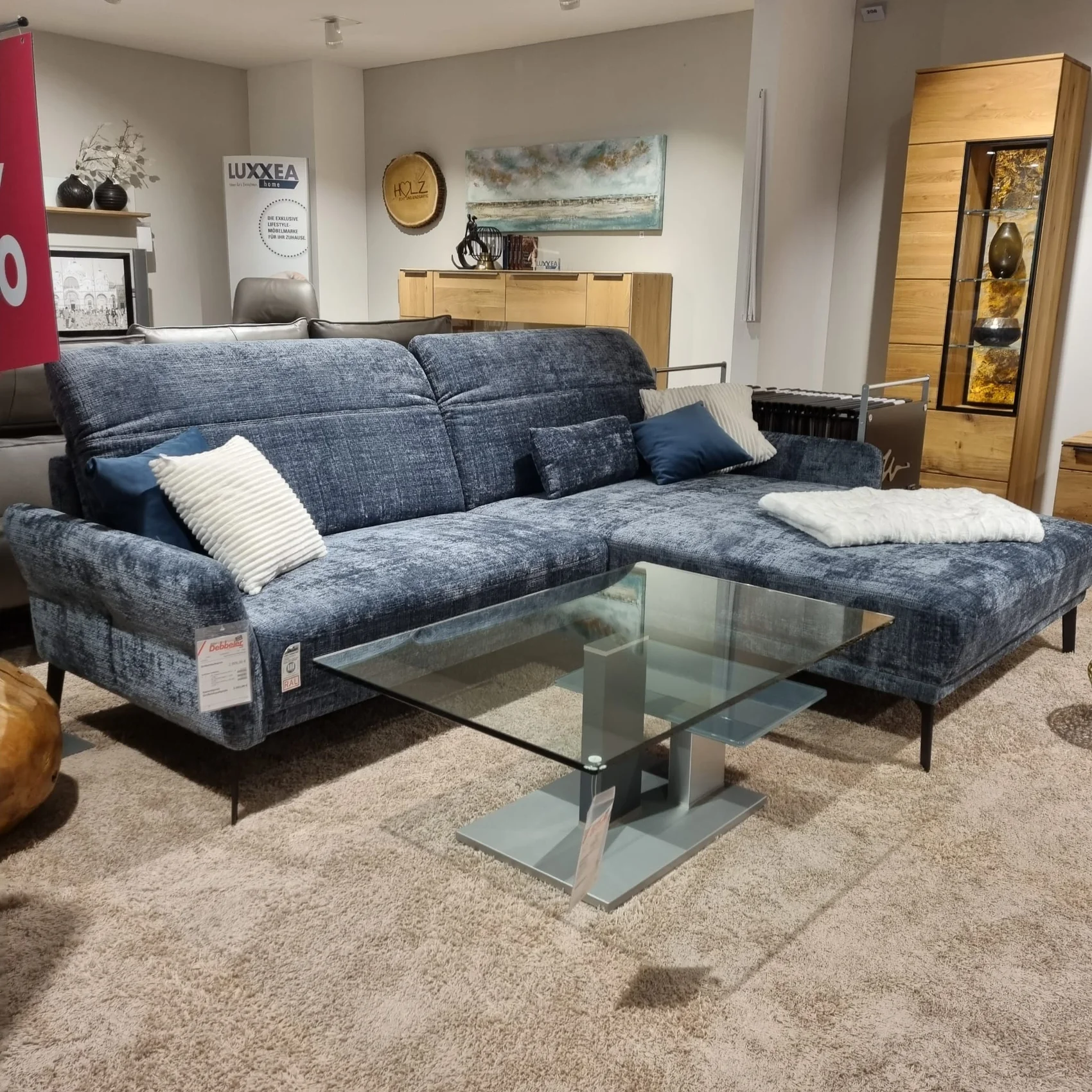 Ecksofa aus blauen Stoff mit Funktionen